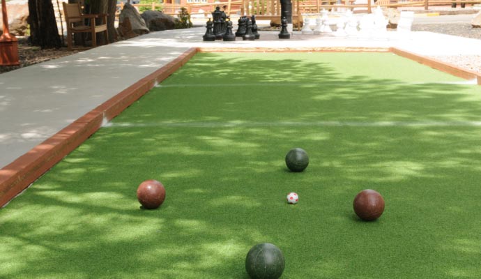 Installed turf for bocce ball court in outdoor area near park