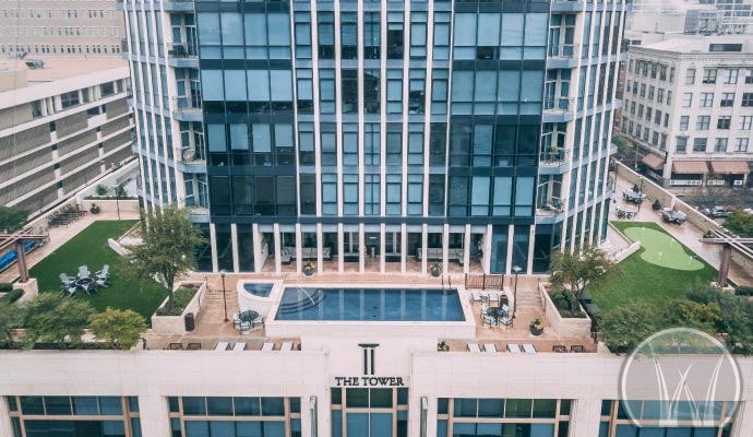 Commercial building rooftop covered with synthetic turf grass for a green outdoor space