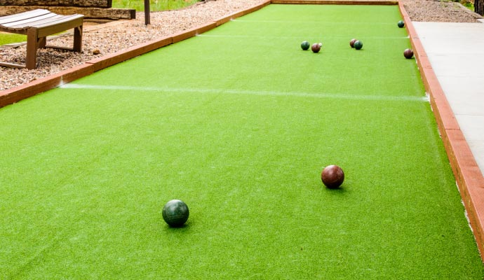New bocce ball court with artificial grass installation.