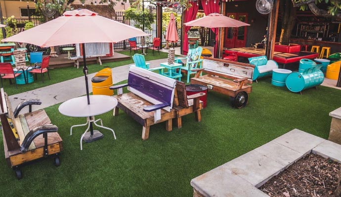 Artificial turf installed in a restaurant’s outdoor dining area