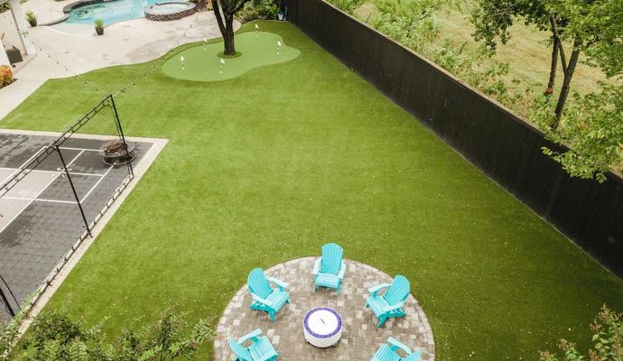 Installed turf under trees in residential backyard