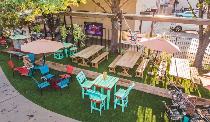 Installed artificial grass for patios, outdoor dining areas in restaurant