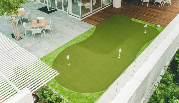 Installed rooftop golf area with synthetic turf.