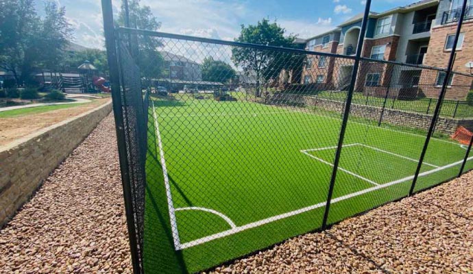 Sports court with synthetic grass