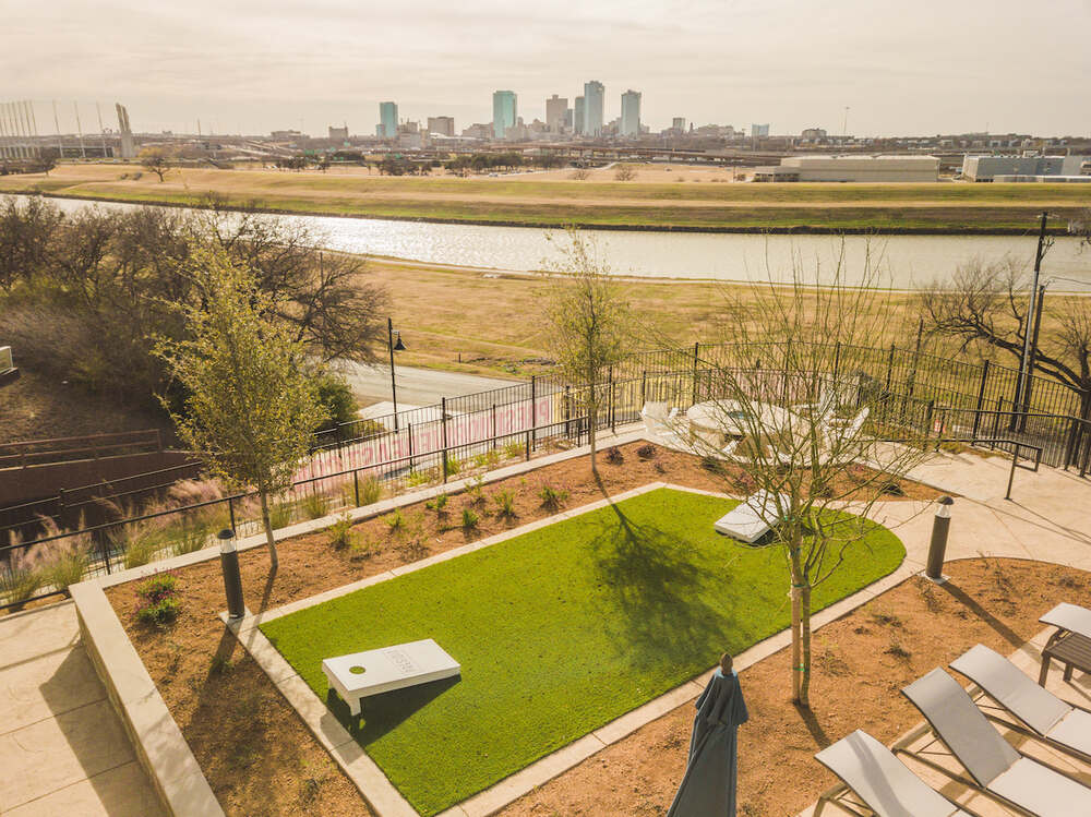 Synthetic Grass Cornhole Space at Apartment Complex